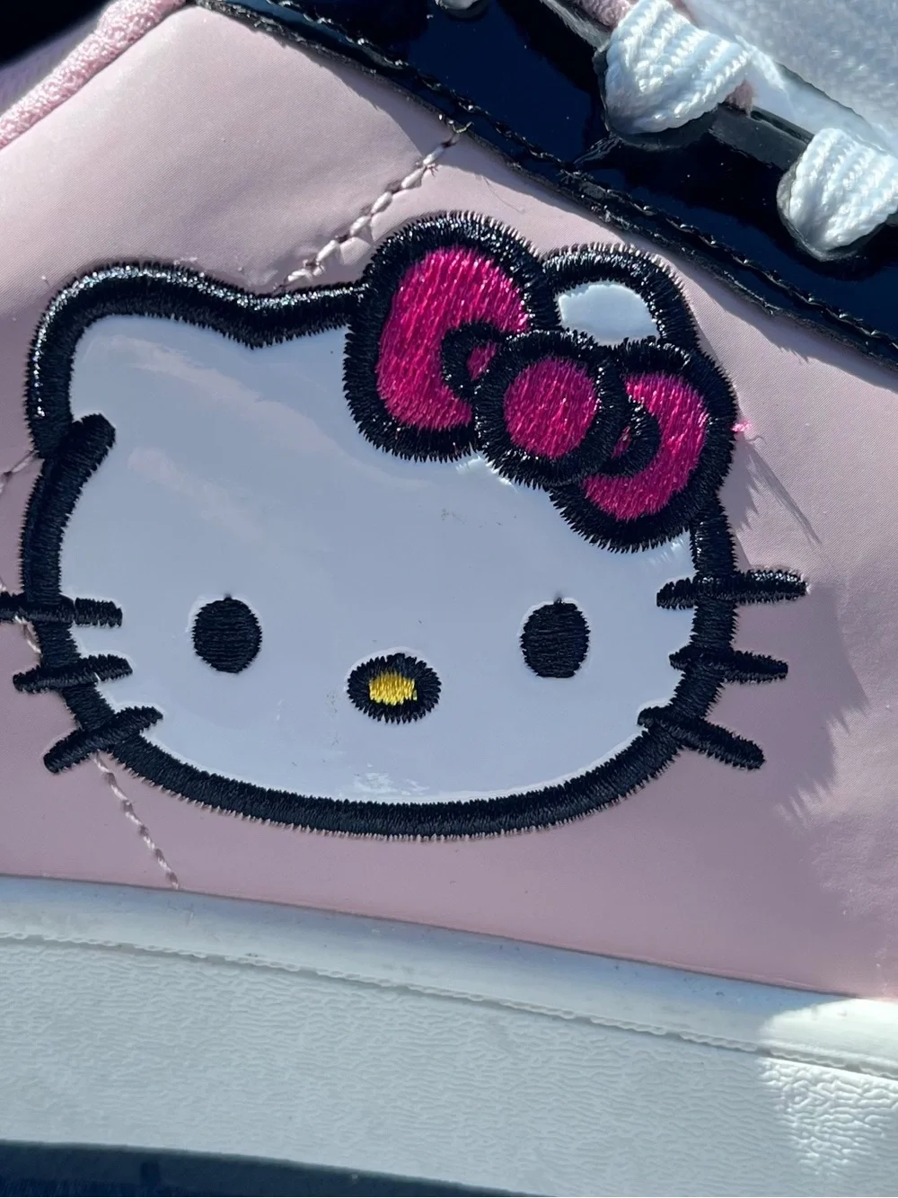 Hello Kitty Pink White and Black women’s NWOT Sneakers with Bow Detail Size 10